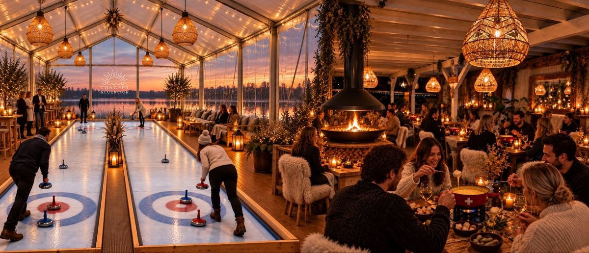 Winterspektakel am See - ueberdachte Eisstockbahn und Fondue-Lounge bei Sonnenuntergang